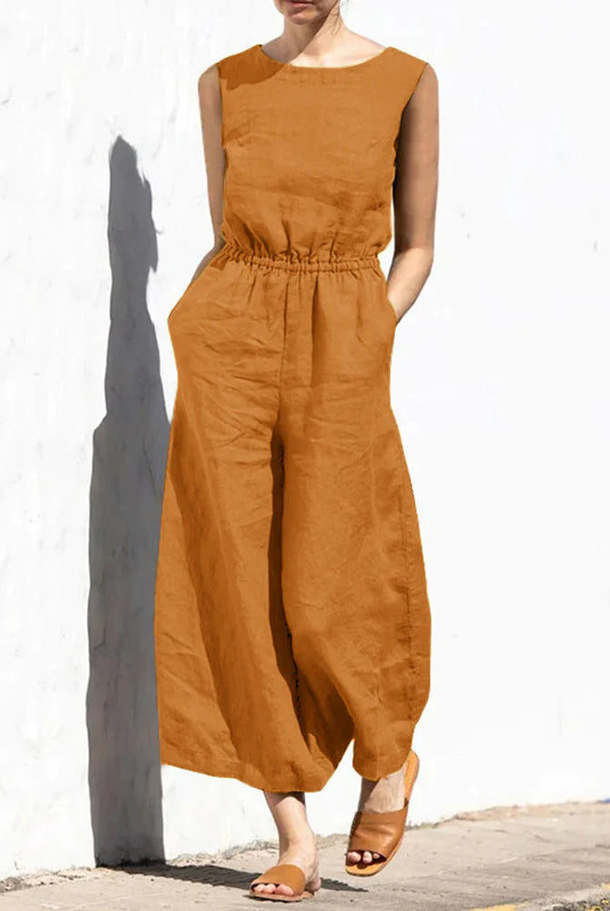 Rust-orange wide leg cotton jumpsuit with elastic waist, perfect for casual and daily wear.