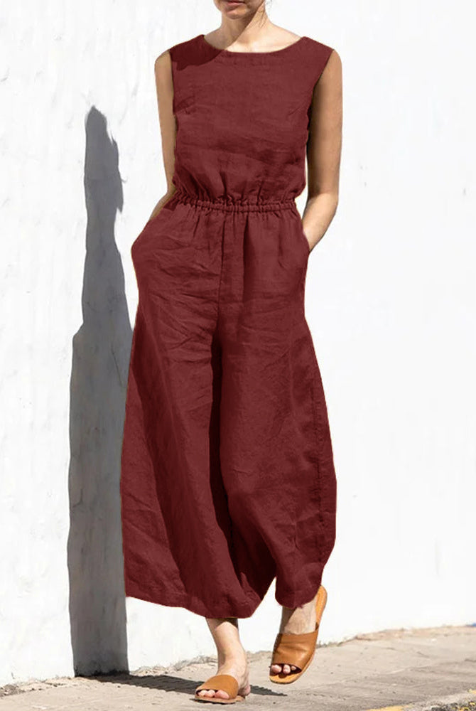 Rust-red wide leg cotton jumpsuit with elastic waist, perfect for casual and daily wear.