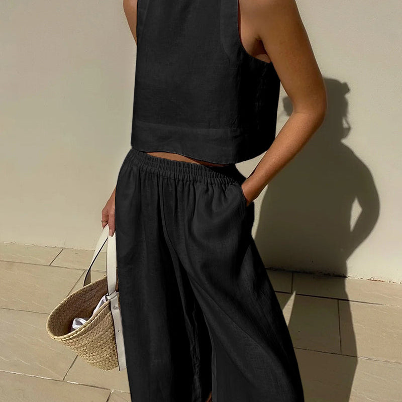 Black linen crop top and wide leg pants set. Vacation style, perfect for summer days.