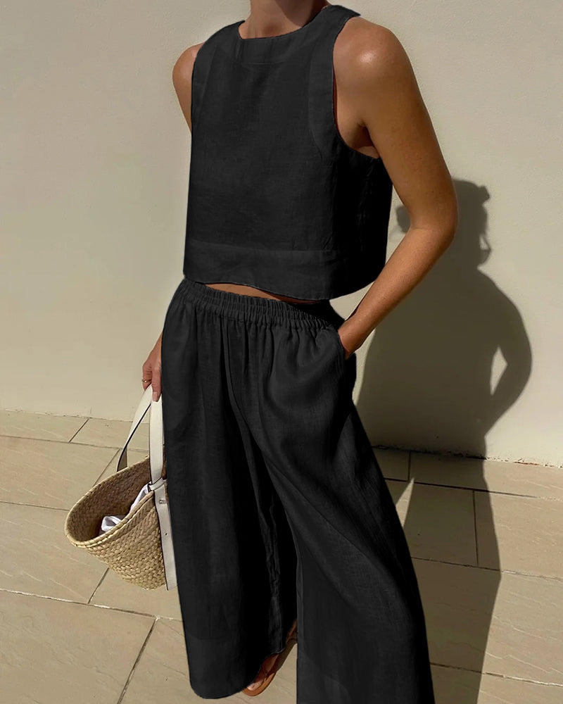 Black linen crop top and wide leg pants set. Comfortable and stylish summer outfit for women.