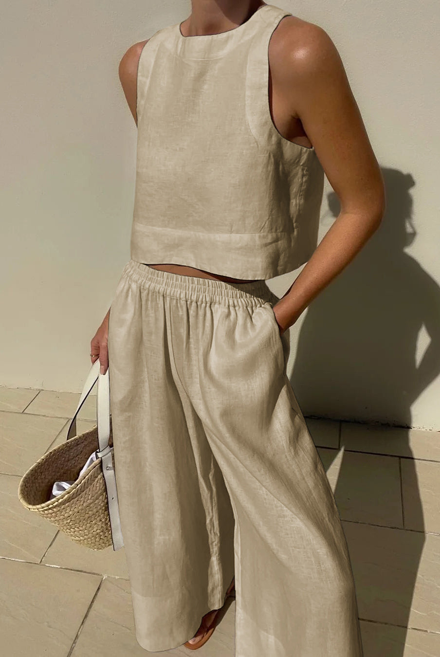 Beige linen crop top and wide leg pants set. Vacation style, breathable linen outfit for summer.