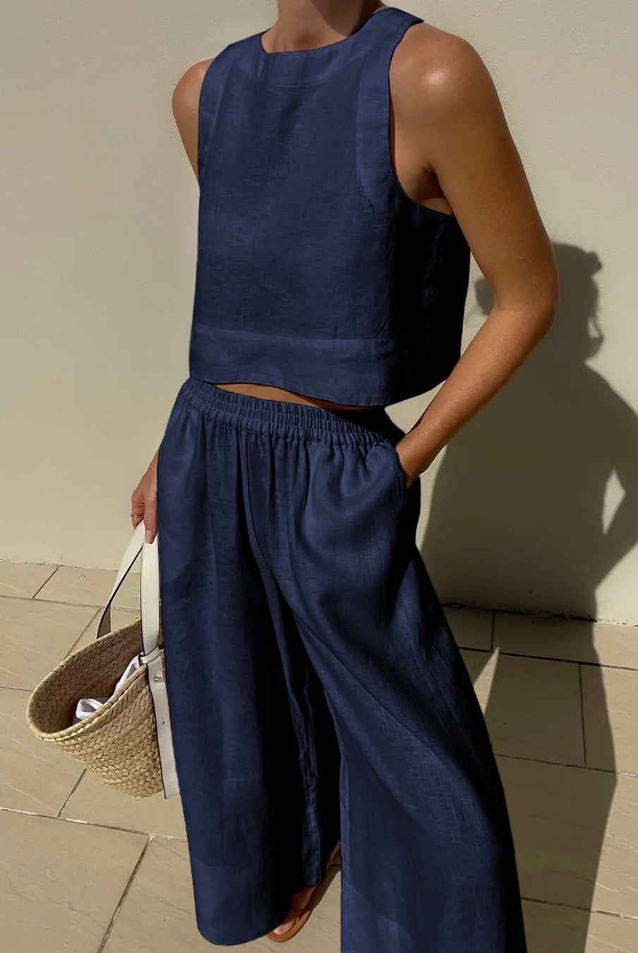 Navy blue linen crop top and wide leg pants set. Vacation style, breathable summer outfit.