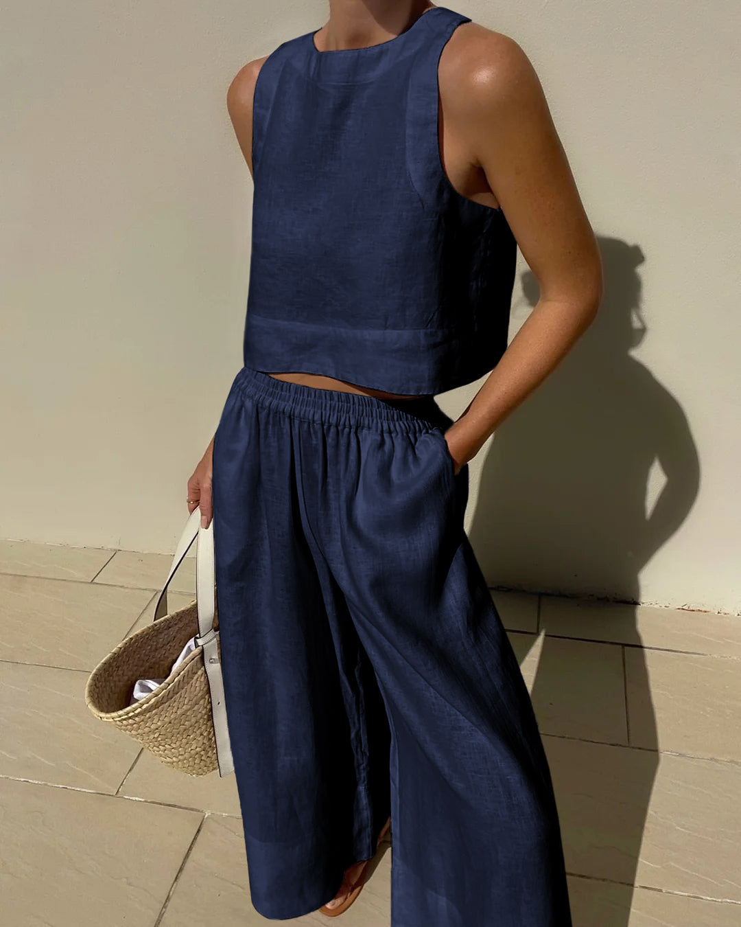 Navy blue linen crop top and wide leg pants set. Vacation style, breathable summer outfit.