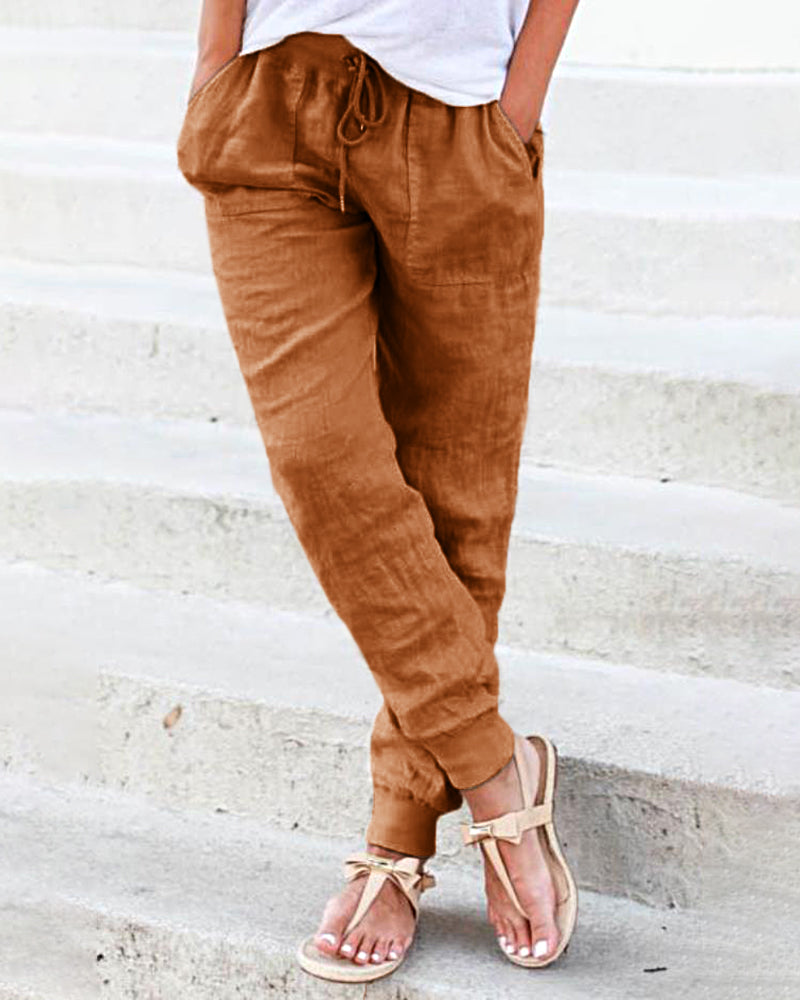 Brown drawstring jogger pants with pockets, casual style, perfect for leisure and daily wear.