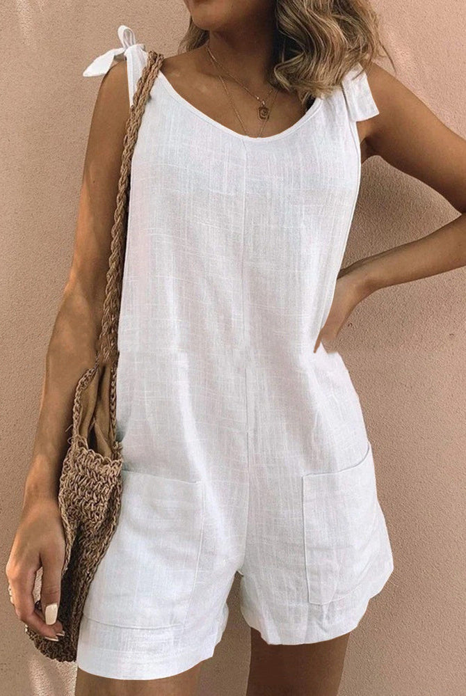 White linen pocket shorts jumpsuit with tie shoulder straps, casual summer outfit