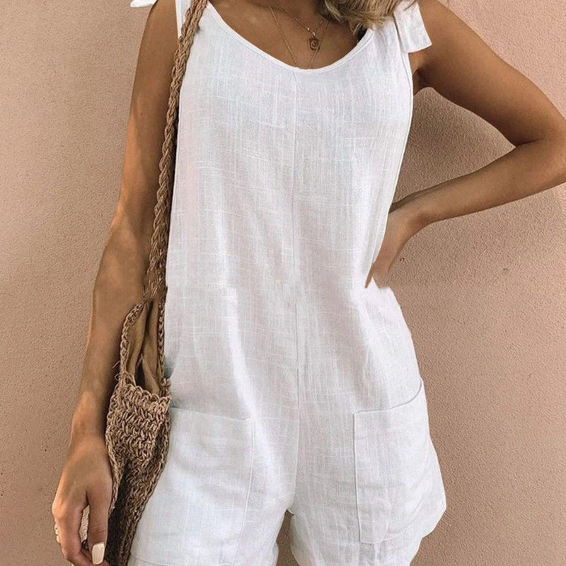 White linen pocket shorts jumpsuit with tie shoulder straps, casual summer outfit