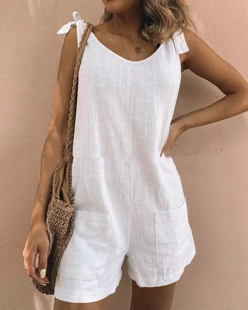 White linen pocket shorts jumpsuit with tie shoulder straps, casual summer outfit