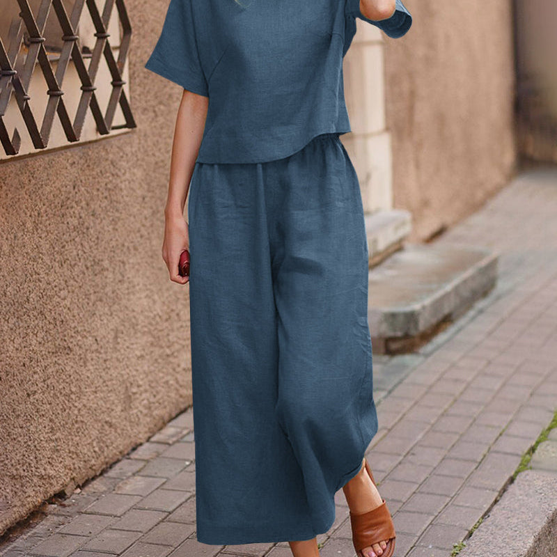 Navy blue two-piece set with loose T-shirt and wide-leg cropped pants