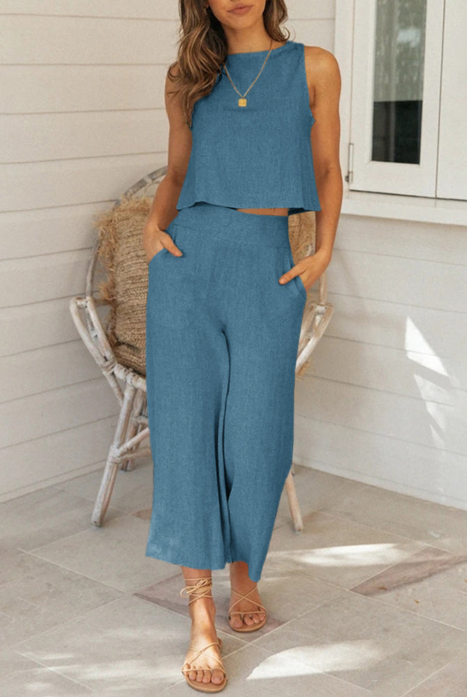 Casual linen two-piece set in light blue, sleeveless top and wide-leg pants, perfect for daily wear.