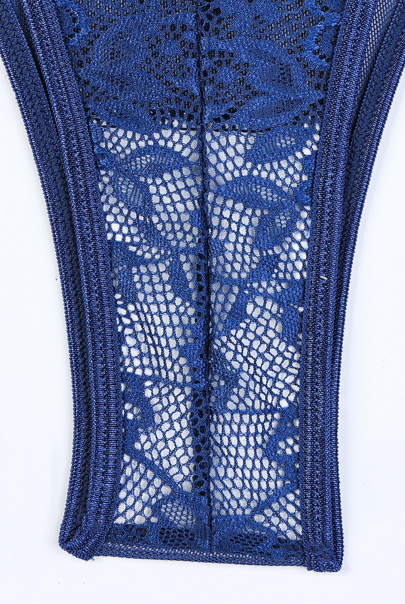 Navy blue floral lace bodysuit detail. Sheer design with satin trim. Sexy lingerie for women.
