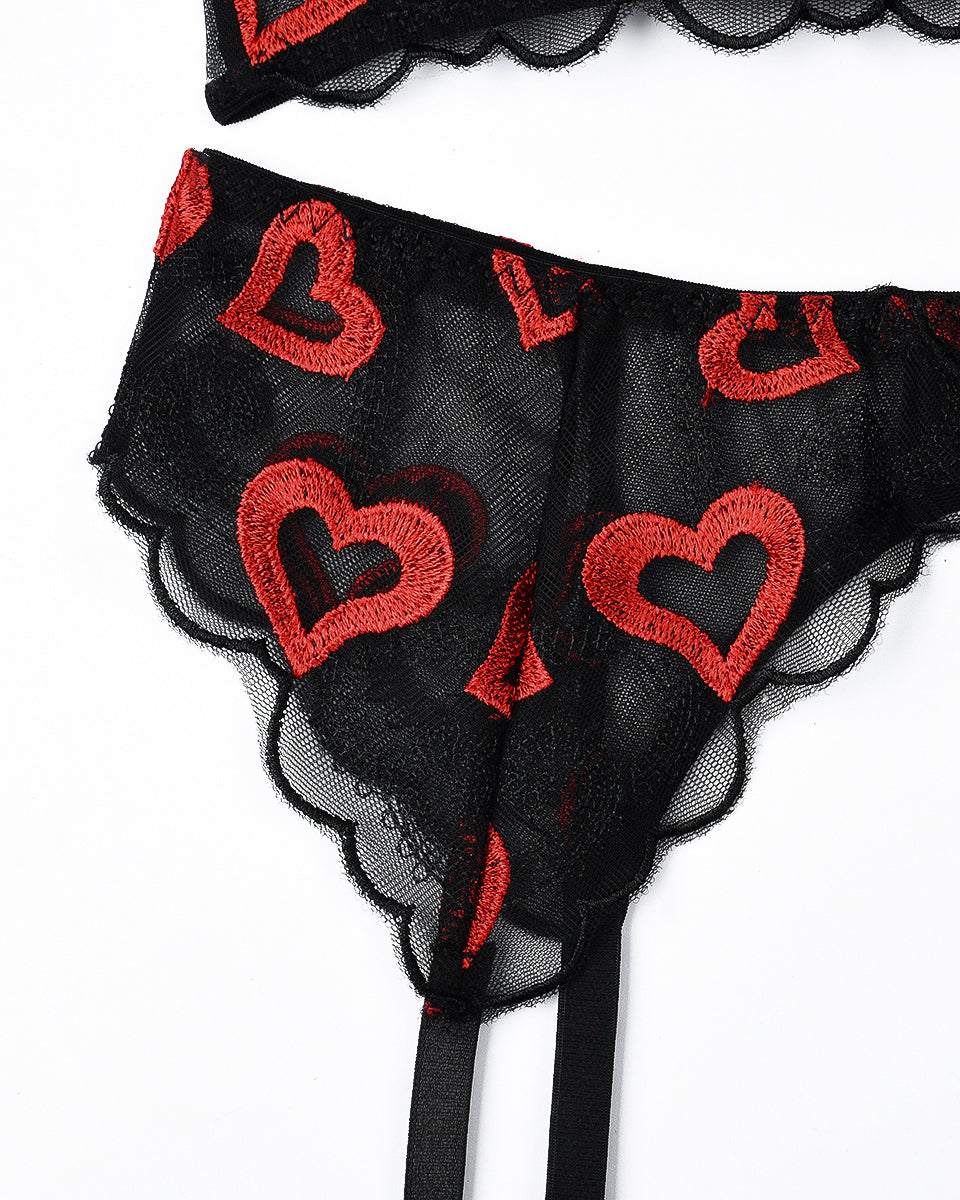 Black lace lingerie set with red heart embroidery; garter belt