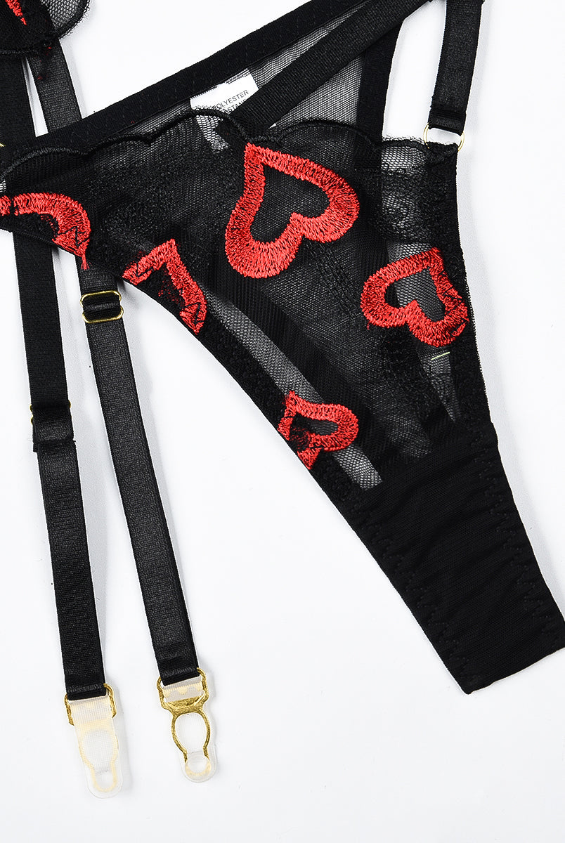 Black lace lingerie set with red heart embroidery; garter belt and thong with adjustable straps