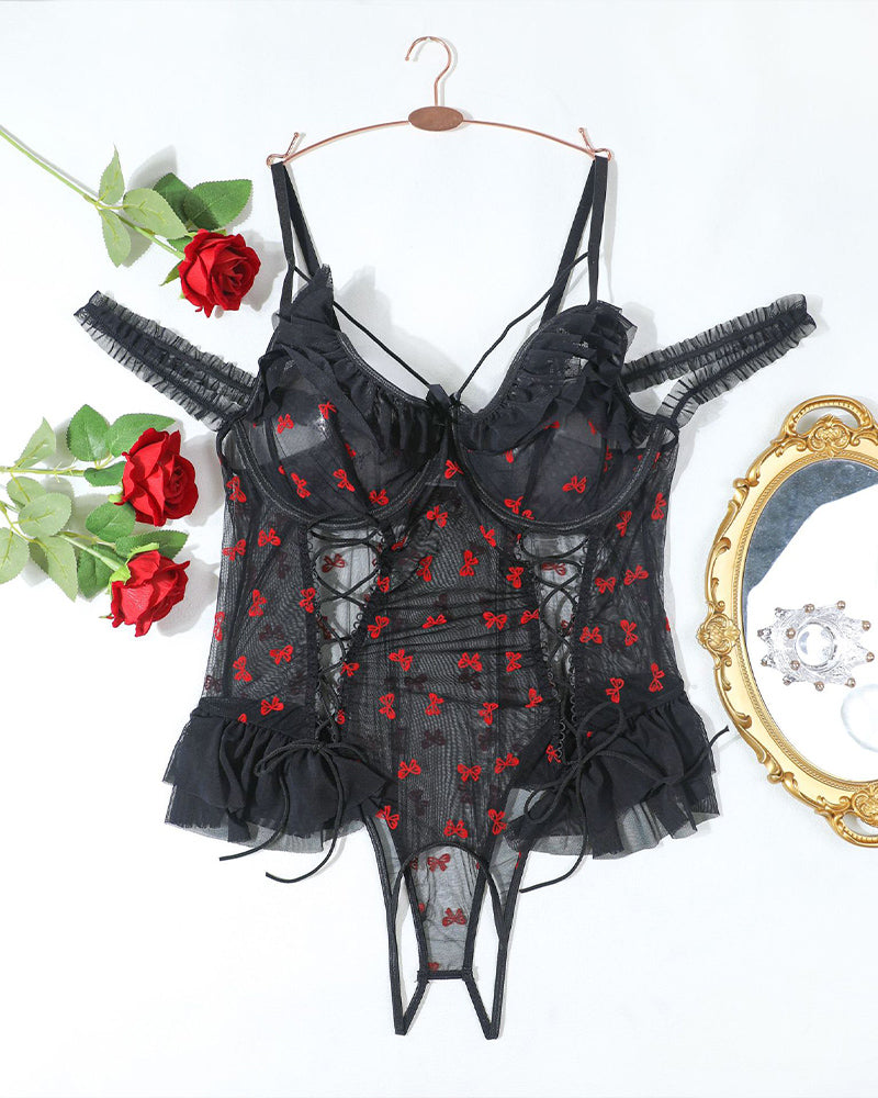 Plus size black lace bodysuit with red bows, lace-up detail, ruffle trim, and adjustable straps