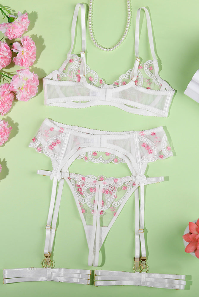 White embroidered heart lingerie set with adjustable straps, offering a sweet yet seductive allure.