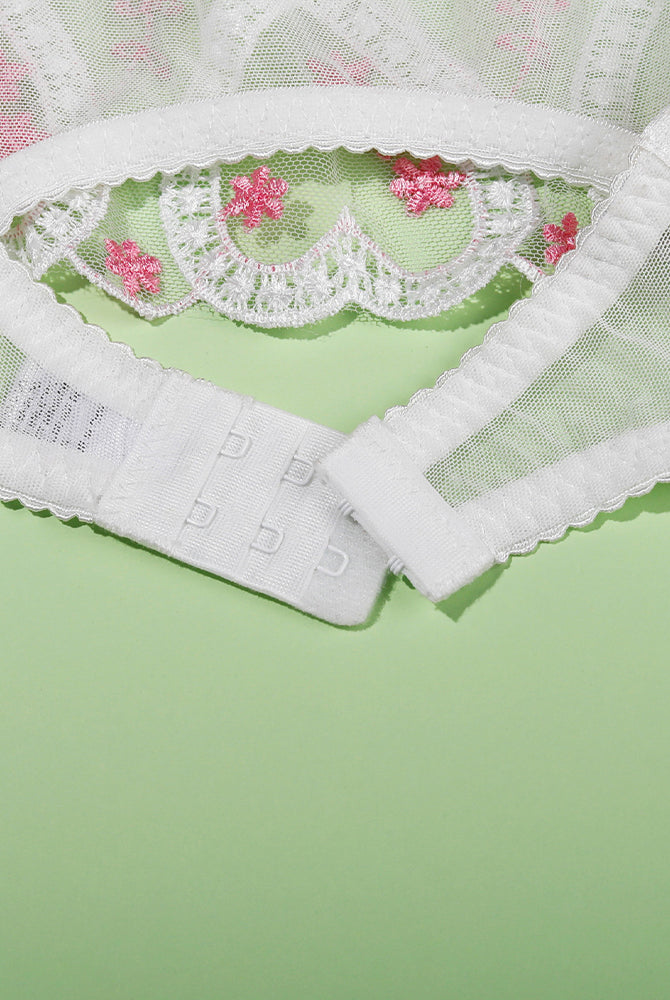 White embroidered heart lace lingerie set with adjustable straps and delicate floral details