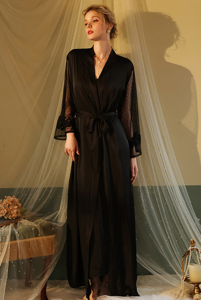 Black satin night robe with lace sleeves, perfect for relaxing evenings. Silky smooth material.