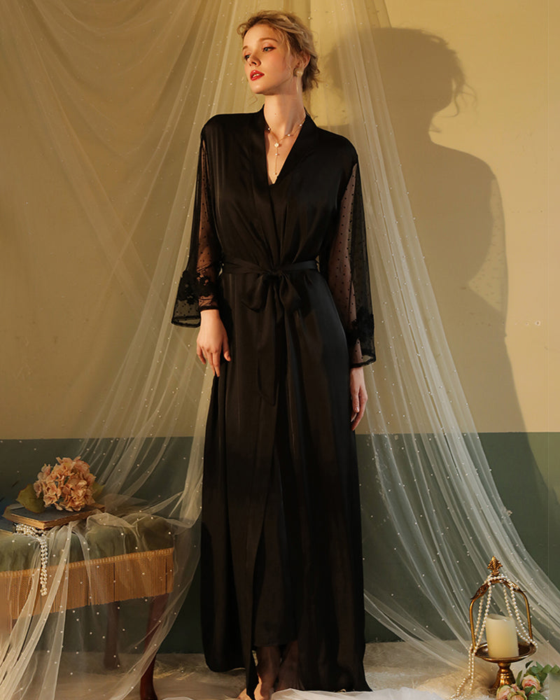Black satin night robe with lace sleeves, perfect for relaxing evenings. Silky smooth material.