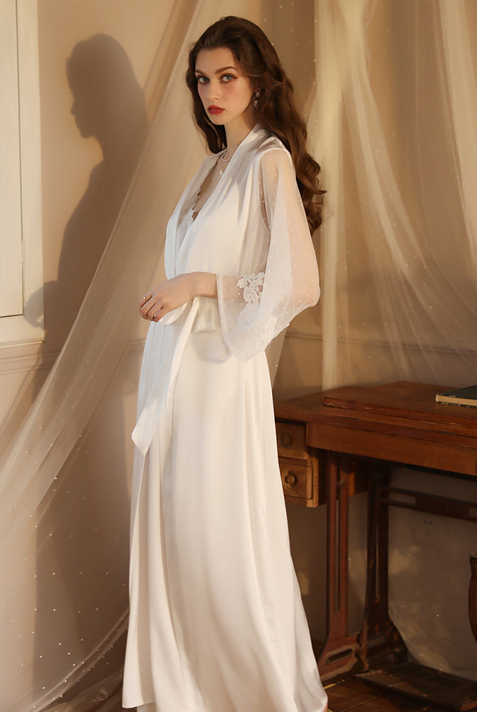 White satin night robe with lace sleeves, perfect for relaxing evenings. Silky smooth material.