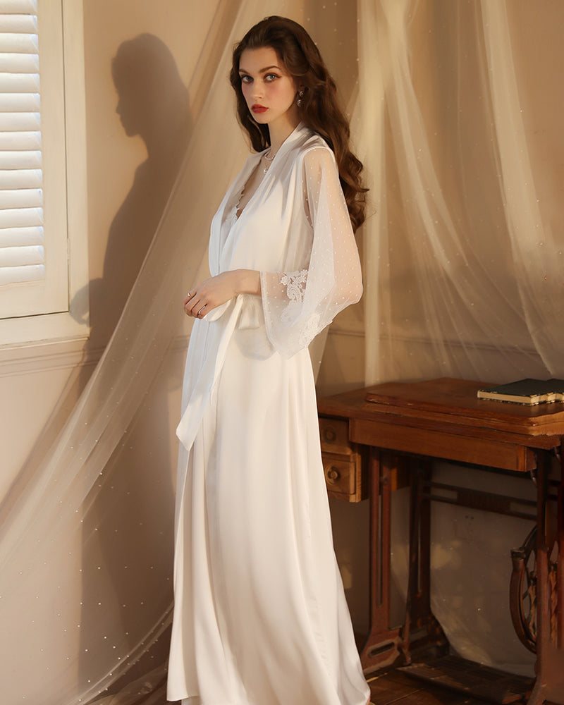 White satin night robe with lace sleeves, perfect for relaxing evenings. Silky smooth material.