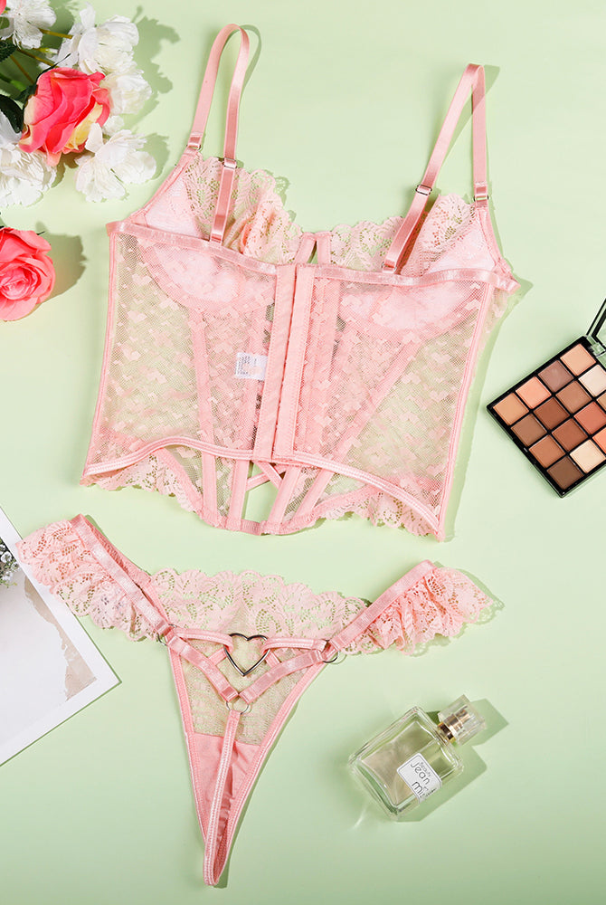Pink lace heart corset with lace thong set, flat lay with lace trim and lacing