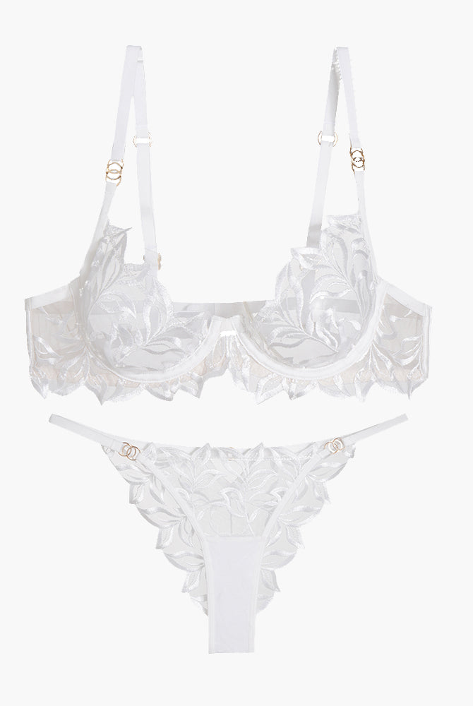 White embroidered lace bra and panty set with floral design, adjustable straps, and see-through