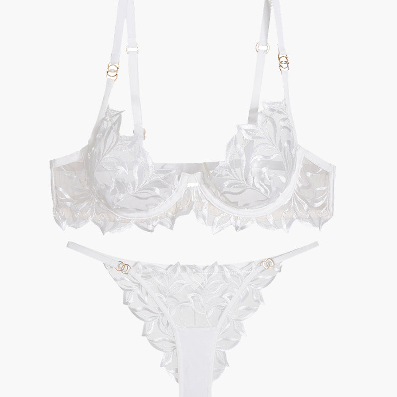 White embroidered lace bra and panty set with floral design, adjustable straps, and see-through