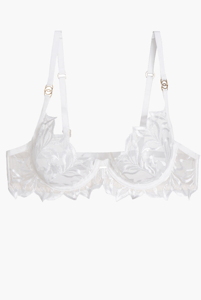 White embroidered lace bra with adjustable straps and underwire, featuring a delicate floral design.