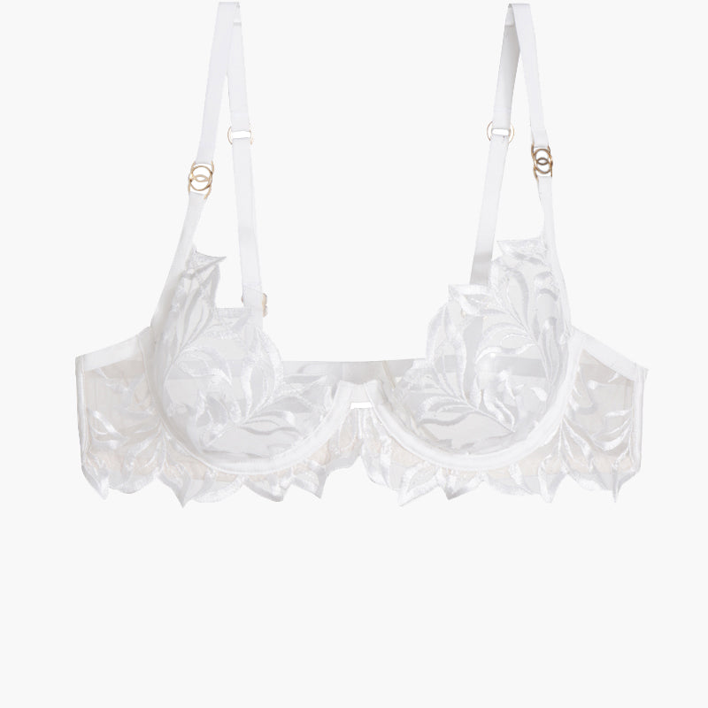 White embroidered lace bra with adjustable straps and underwire, featuring a delicate floral design.