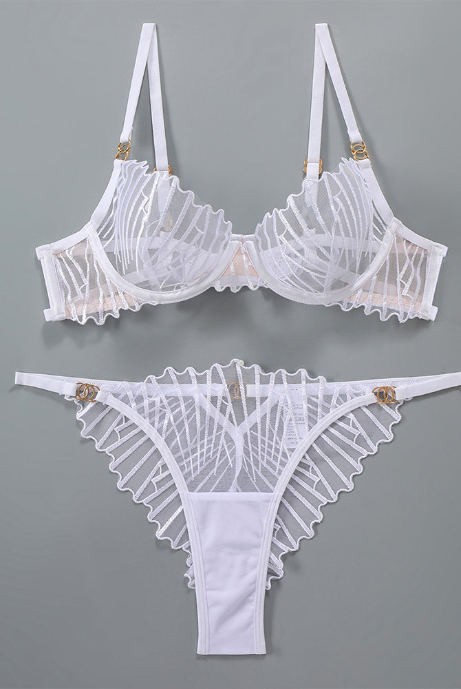 White lace lingerie set with adjustable straps and embroidered details, sweet yet seductive.