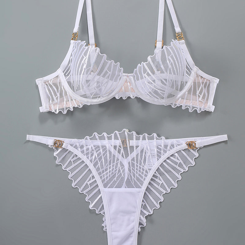 White lace lingerie set with adjustable straps and embroidered details, sweet yet seductive.