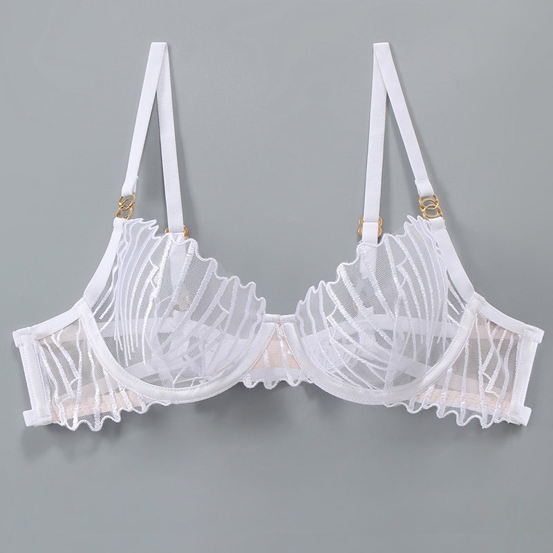 Delicate white embroidered bra with adjustable straps and lace details; sweet yet seductive.