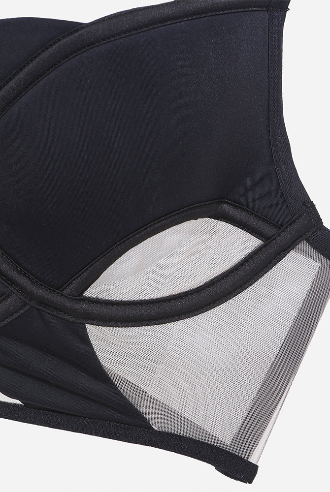 Black push-up bra with mesh details. Seductive lingerie with underwire and adjustable straps.
