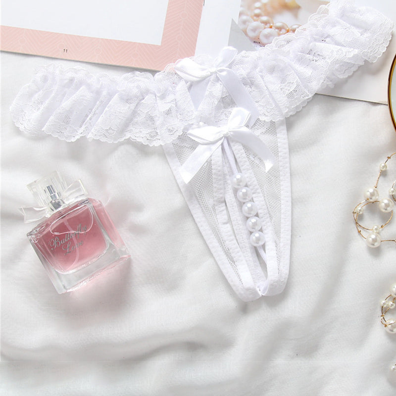 White lace crotchless panty with faux pearls, low rise design, and bow accents. Sexy lingerie.