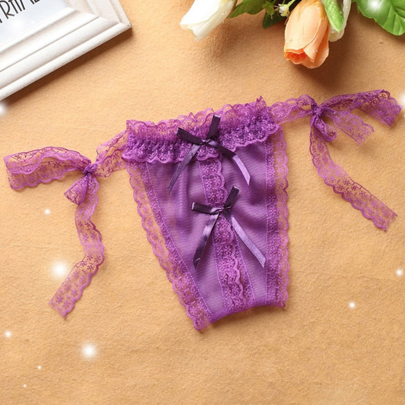 Purple lace crotchless thong with lace-up ribbon ties and front bow.