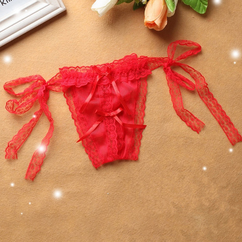 Red lace crotchless thong with lace-up side ties and bow at front.