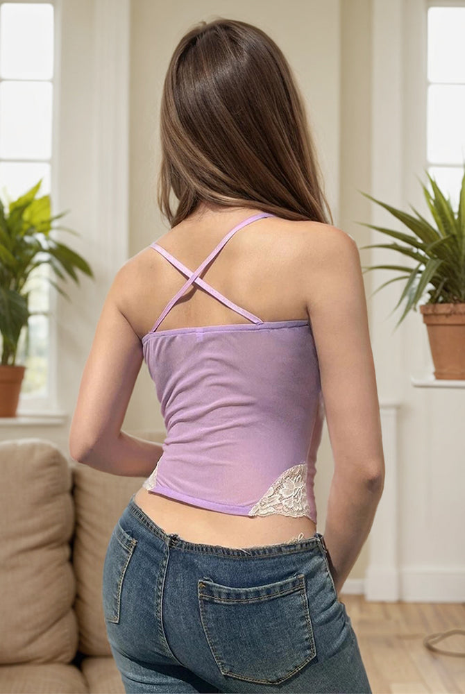 Lavender patchwork crop top with lace, cross-back design, paired with jeans. Boho beach outfit.