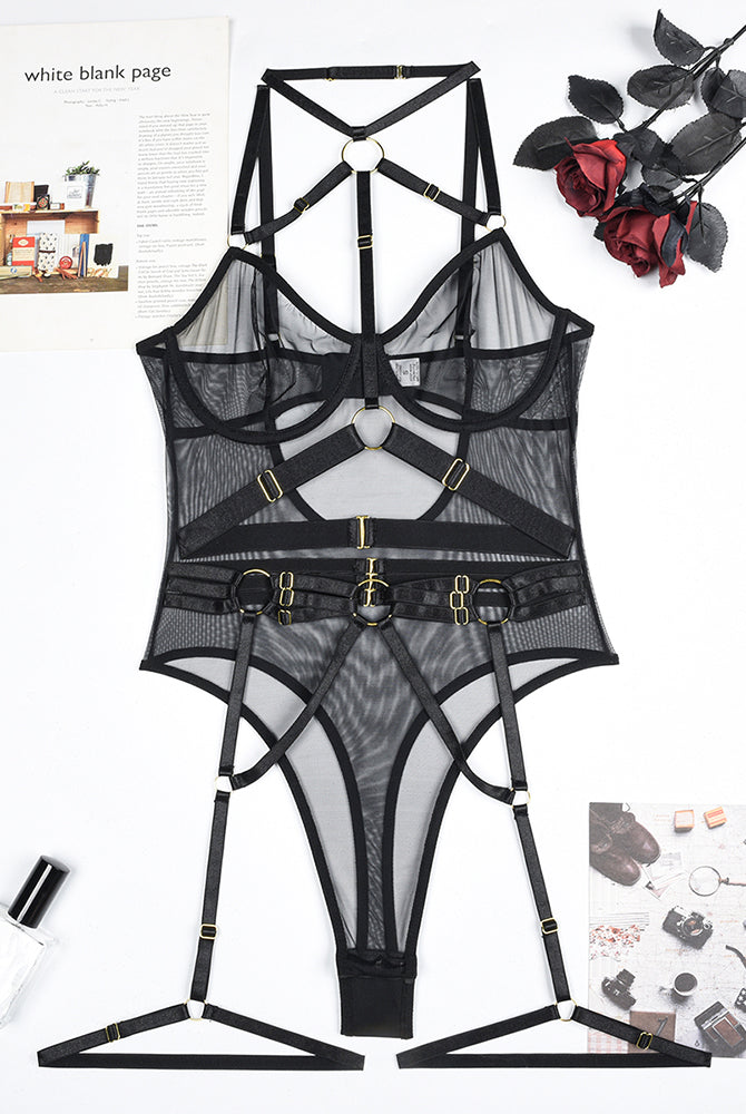 Mesh straps bodysuit with steel ring details. Black lingerie with halter neck and garter straps.