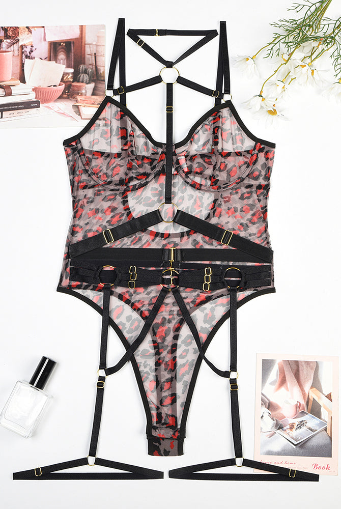 Leopard print mesh bodysuit with red leopard pattern, black straps, and steel rings