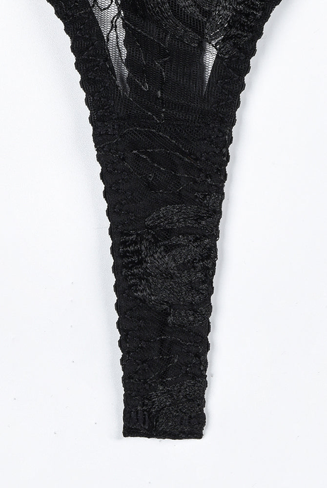 Black vintage lace thong with floral embroidery. Part of a luxurious lingerie set.