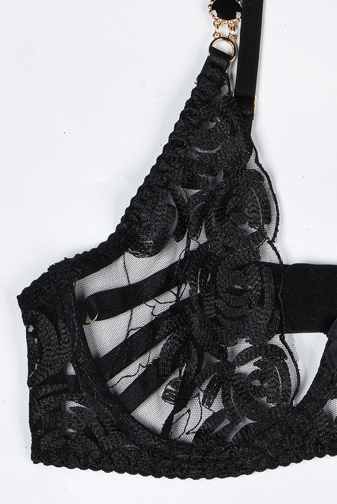 Black vintage gemstone lace bra with floral embroidery. Luxurious lingerie with elegant details.
