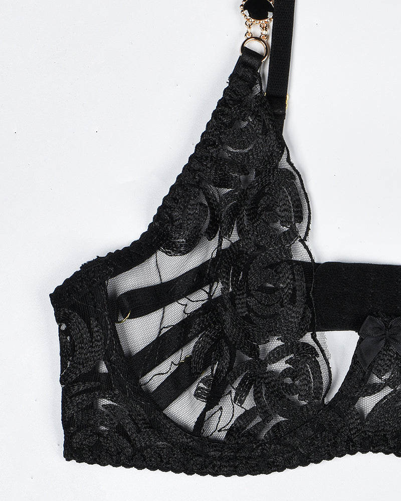 Black vintage gemstone lace bra with floral embroidery. Luxurious lingerie with elegant details.