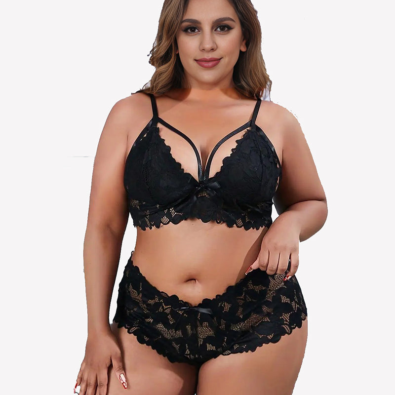 Plus size black lace bra and panty set with floral appliques and bow knot details.