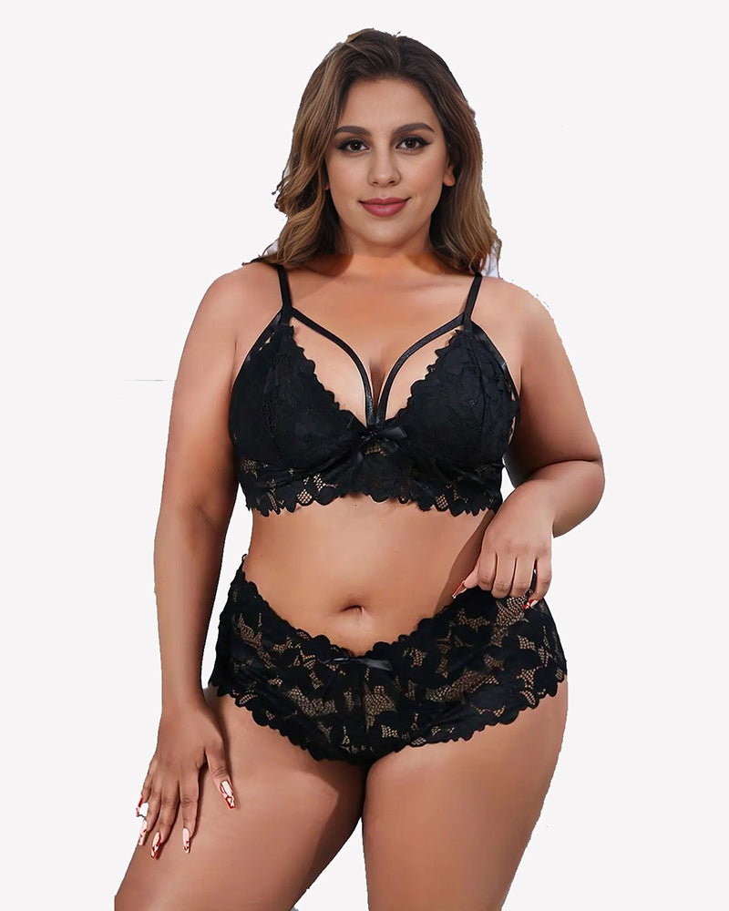 Plus size black lace bra and panty set with floral appliques and bow knot details.