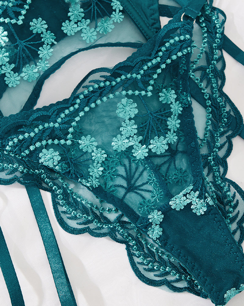 Teal embroidered lace lingerie set with garter, featuring floral design; perfect for special nights