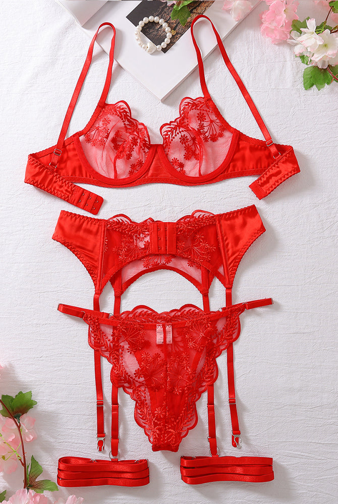 Red embroidered lace lingerie set with garter belt; ideal for special nights.