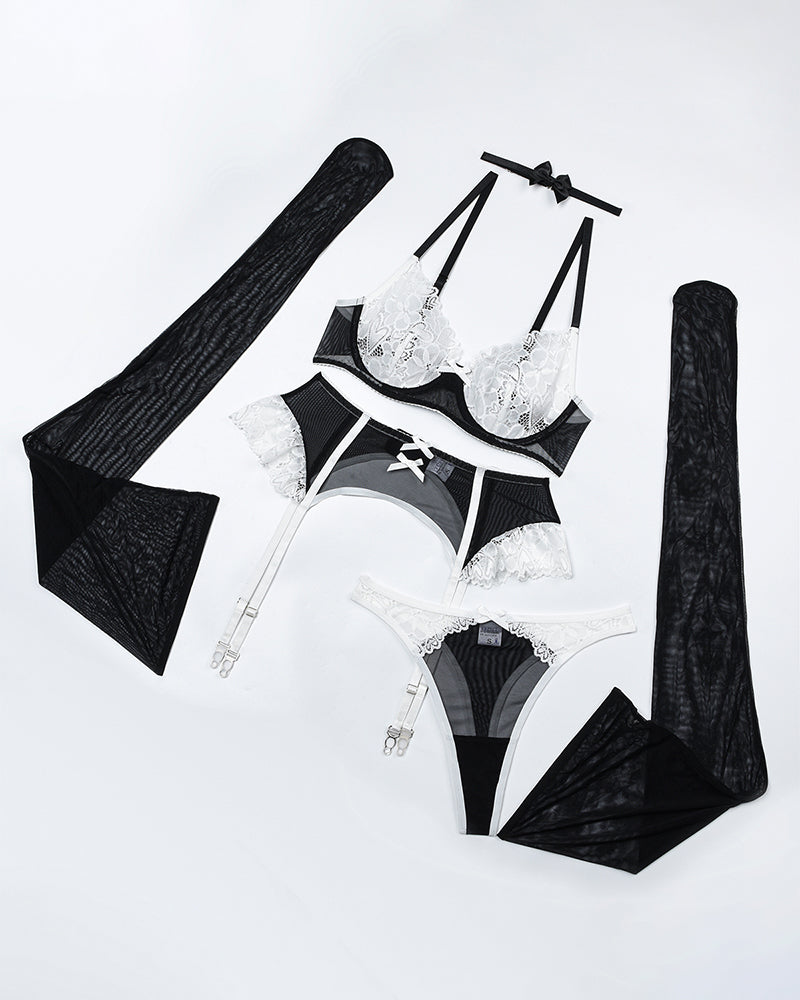 Black and white lace lingerie set with choker, push-up bra, garter belt, and stockings
