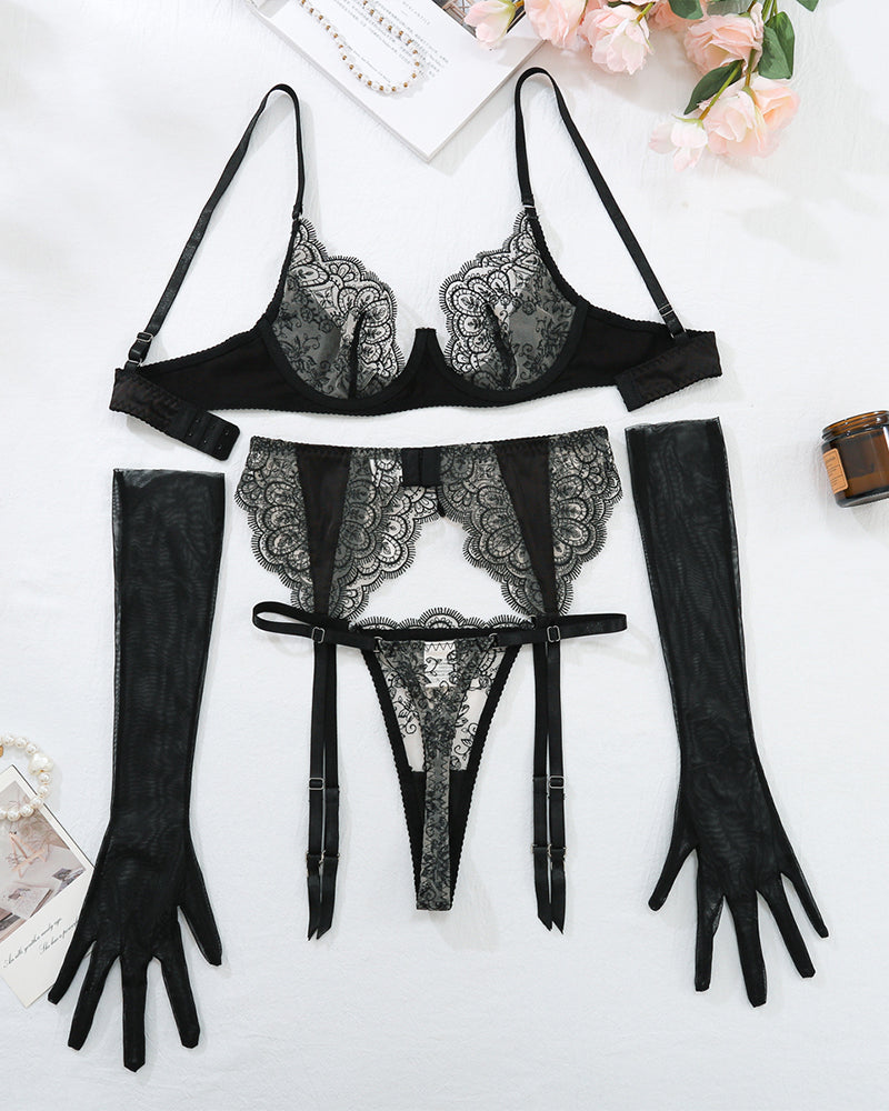 Black lace lingerie set with garter belt, gloves, and thong. Floral embroidery, elegant design.
