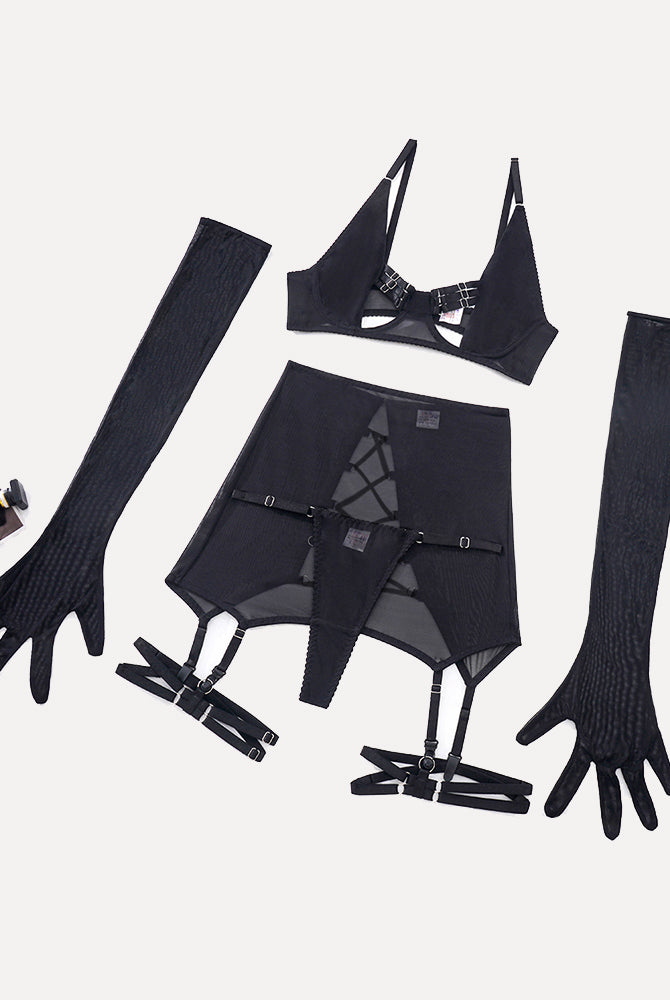 Black lingerie set with sheer skirt, open bust bra, and gloves. Sensual and elegant design.