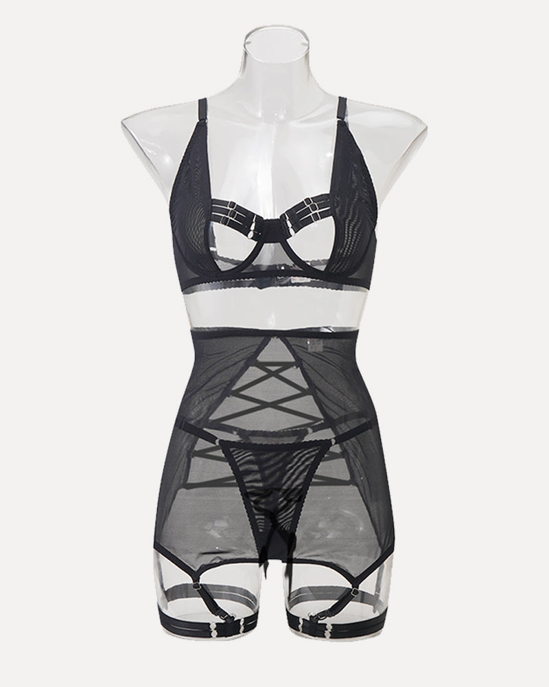 Black open-bust lingerie set with sheer skirt and garter straps. Sensual and elegant design.