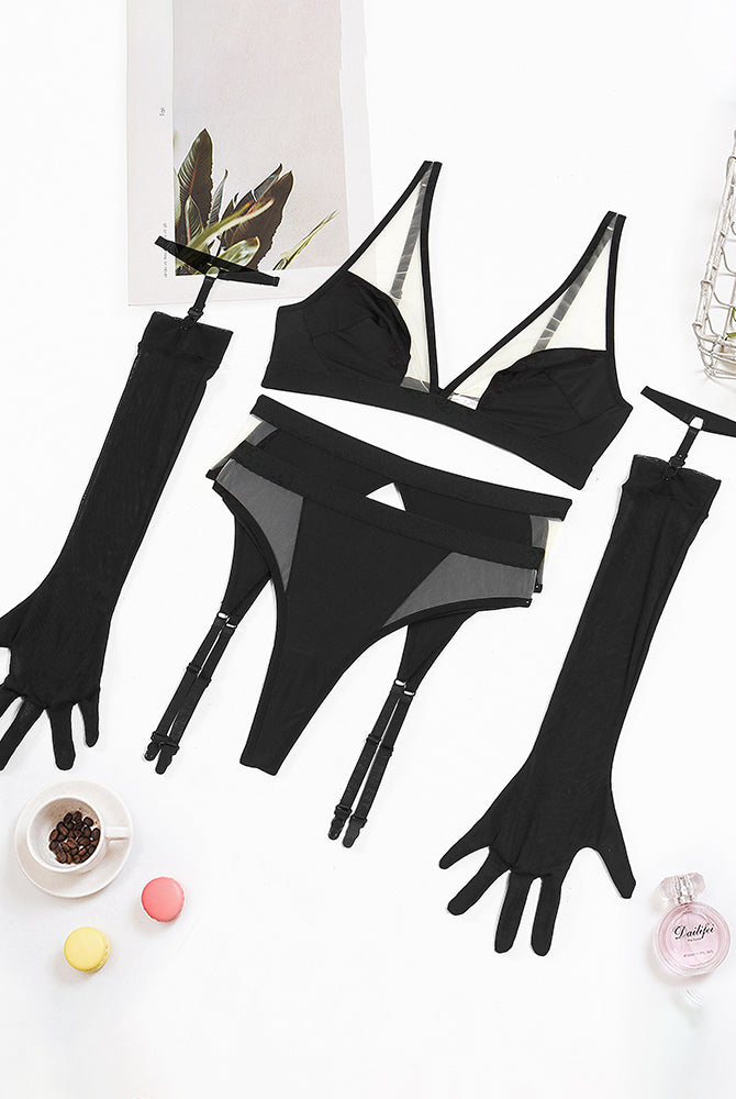 Black mesh lingerie pieces laid flat: bra, garter thong, and long gloves